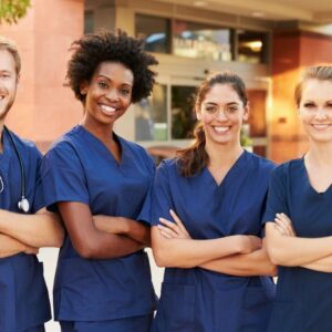 A group of nurses standing next to each other.