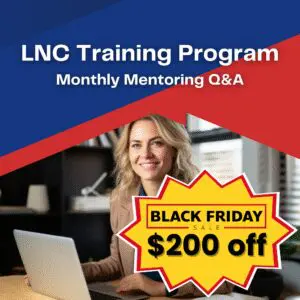 A woman sitting at a table with a laptop.