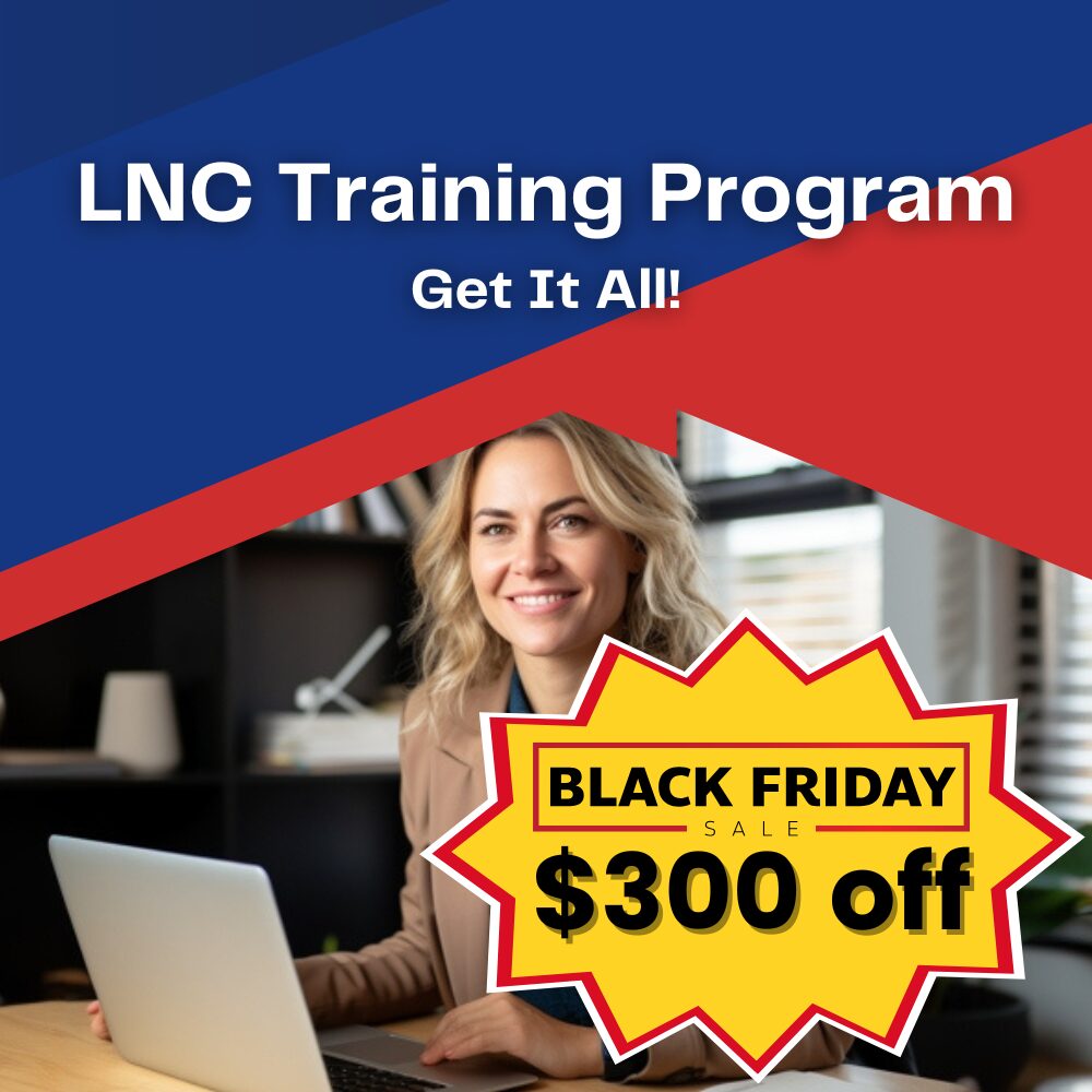 A woman sitting at a table with a laptop.